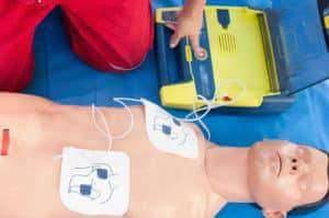 Paramedic activating portable defibrillator